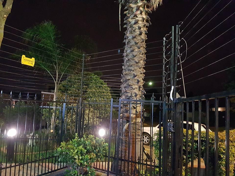 Electric fence repair on a boundary wall